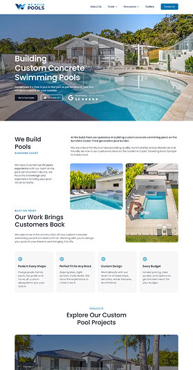 Luxury custom concrete swimming pool with modern design and surrounding landscape.