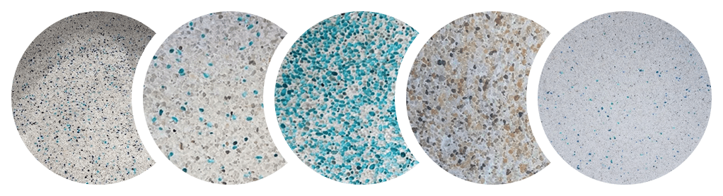 Close-up of textured concrete surface with blue and grey speckles.