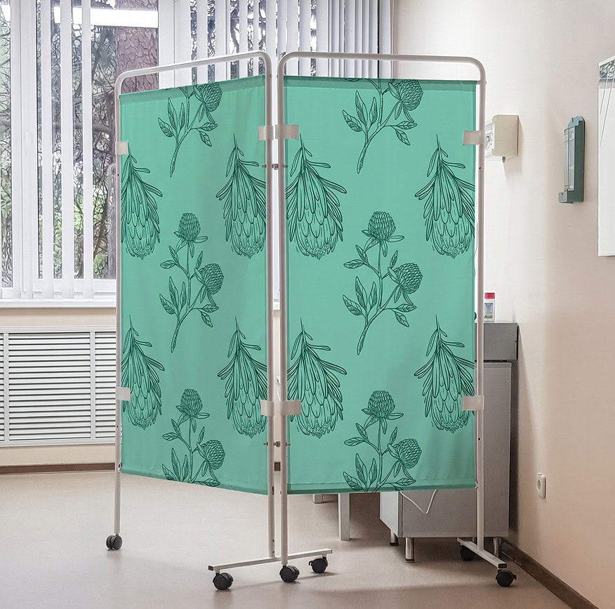 Medical privacy screen with botanical design in a healthcare setting.