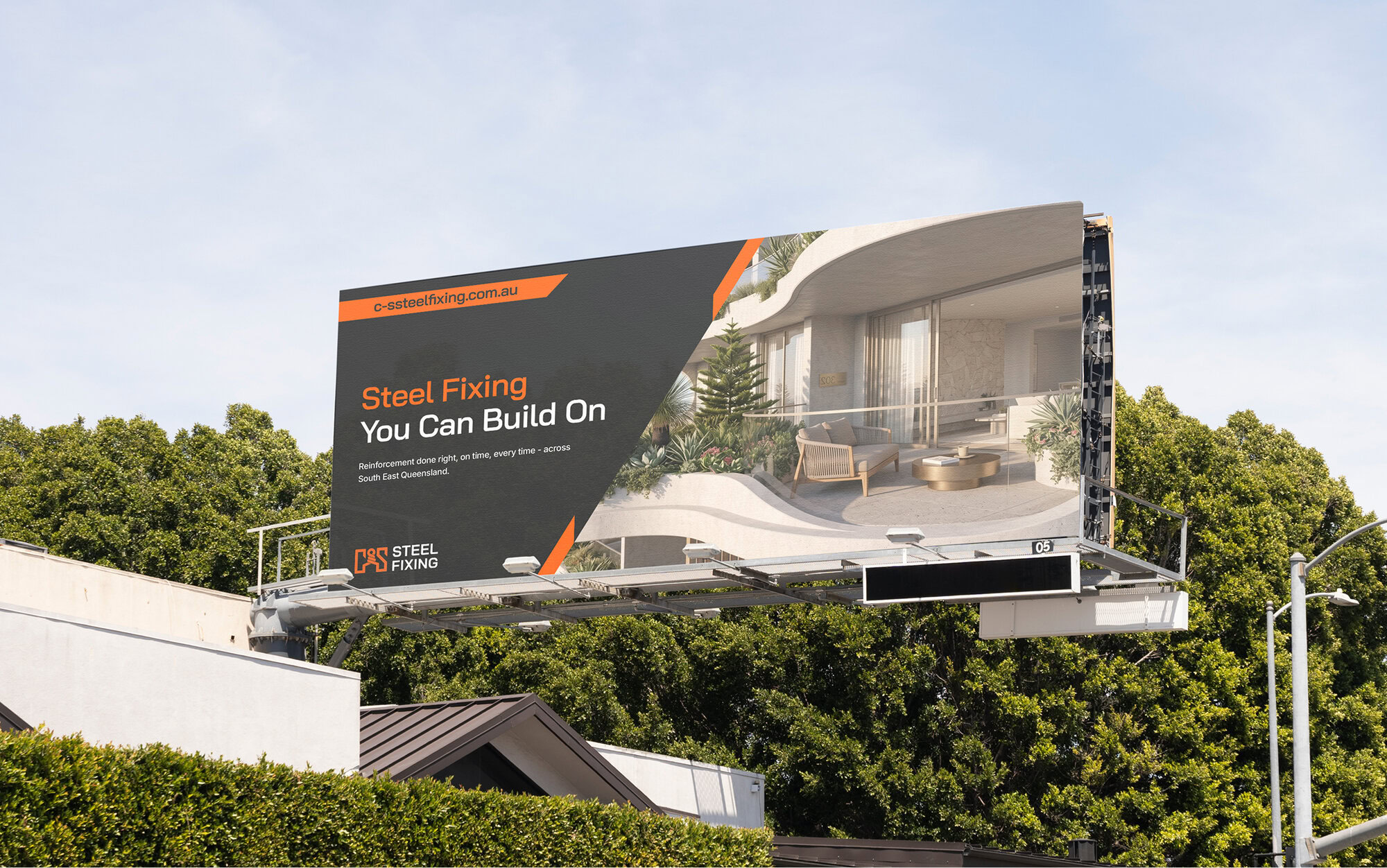 Large billboard advertising steel fixing services on a sunny day.